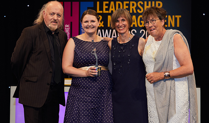 Dr Lucy Pearson and Kate Edwards collect their trophy